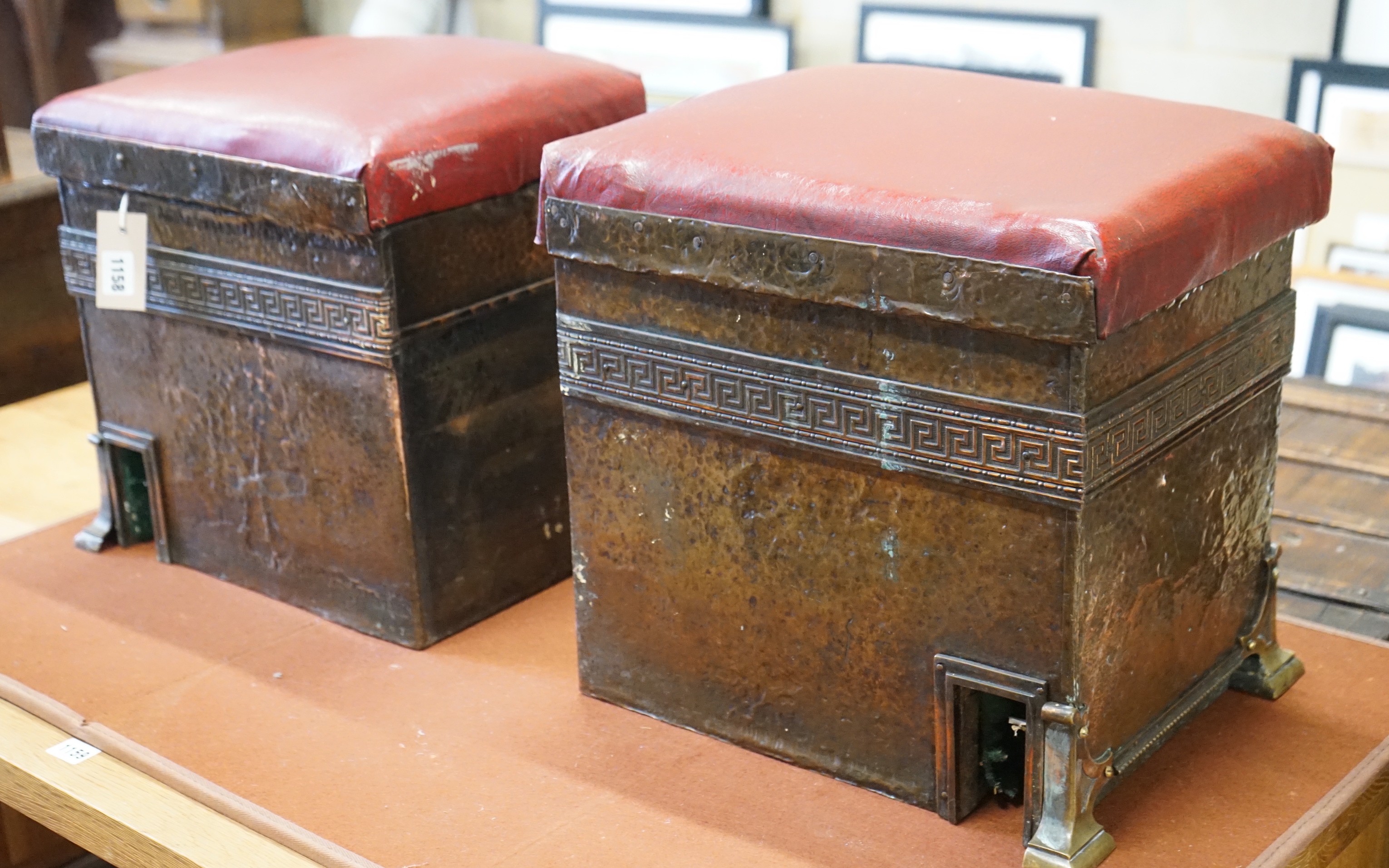 A pair of early 20th century hammered copper fender stools, each width 28cm, depth 37cm, height 36cm